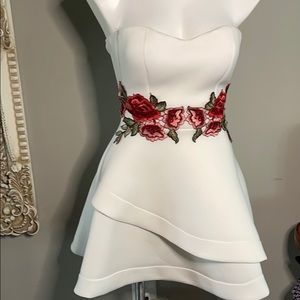 A dress with rose embroidered.Monaco brand